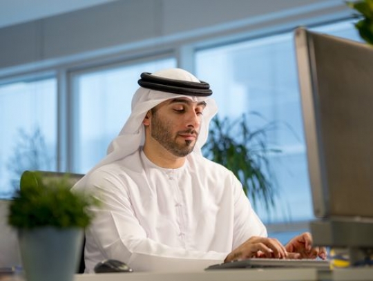 Businessman at his desk typing on the keyboard|