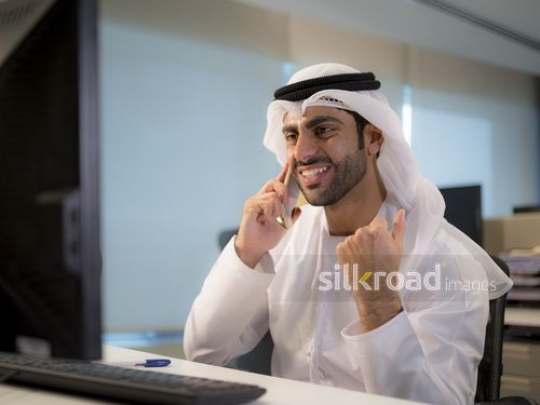 Business man excited at the worplace|