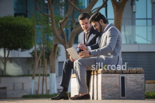 Two employees working together from the laptop |-