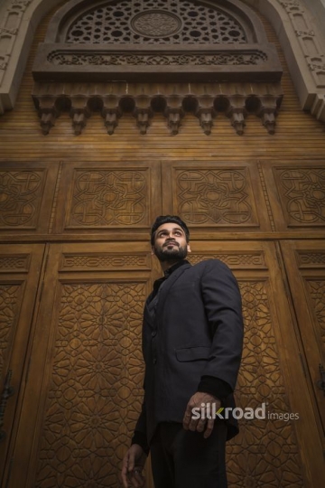 Low Angle shot of a Businessman dressed in a black suit|-