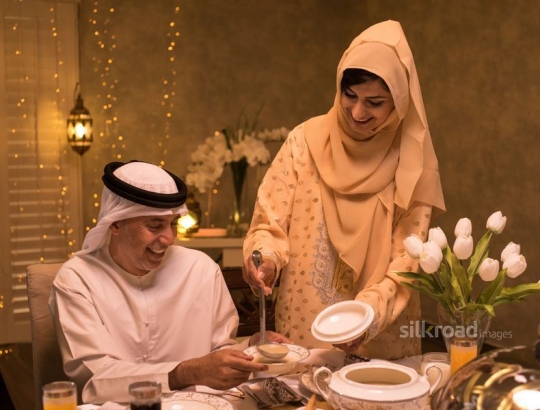 Mother serving soup|-