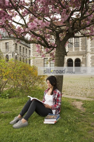 Student reading a book|