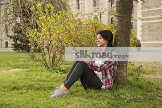 University Student using her mobile|