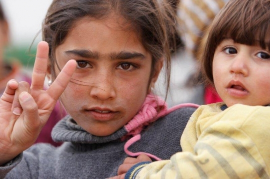 kid showing victory sign