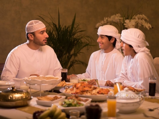 Father with sons having iftar|-