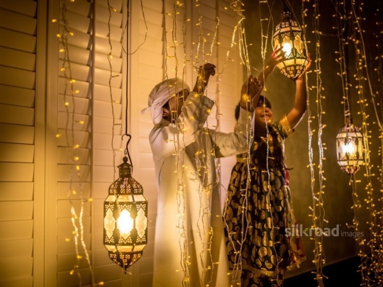 brother and sister fixing lanterns|-