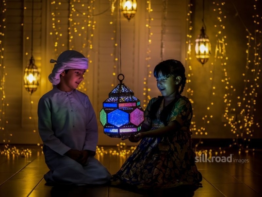 brother and sister  playing with lantern|-