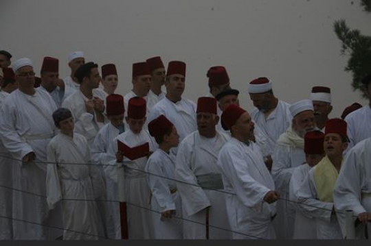 members of the Samaritan community march atop Mount Gerizim, above the West Bank city of Nablus,