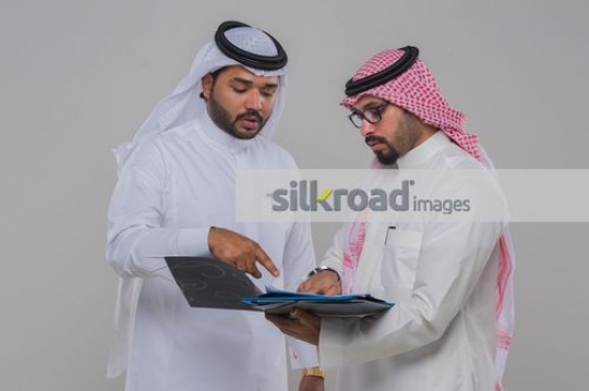 Businessmen talking to each other about work|