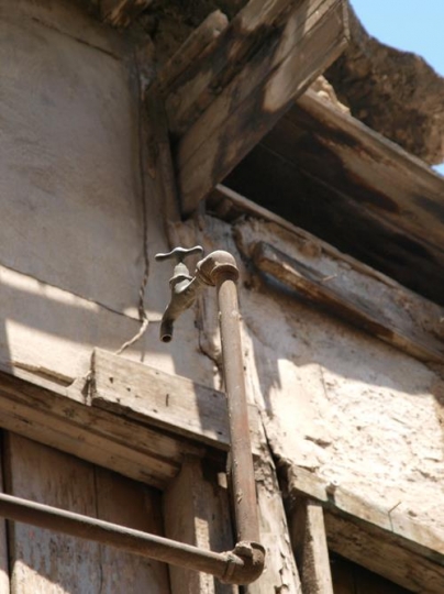 water faucet outside a home