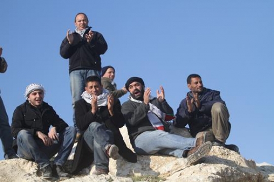 Palestinian demonstrators singing at Bab al-Shams or Gate of the Sun in Arabic, in a bid to draw attention to Israeli plans to boost settlement building in the West Bank area.