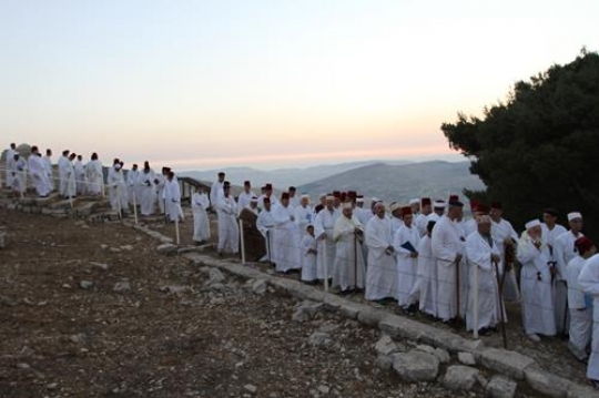 members of the Samaritan community march atop Mount Gerizim, above the West Bank city of Nablus,