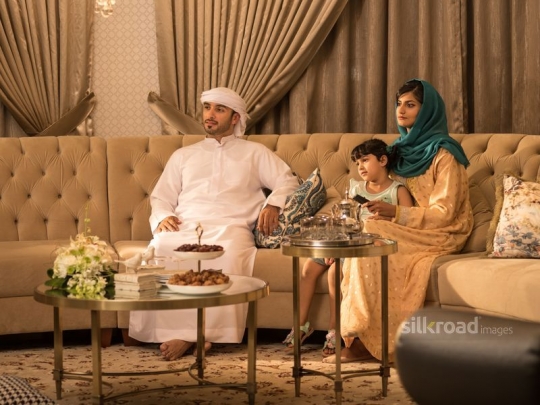 couple with daughter watching TV|-