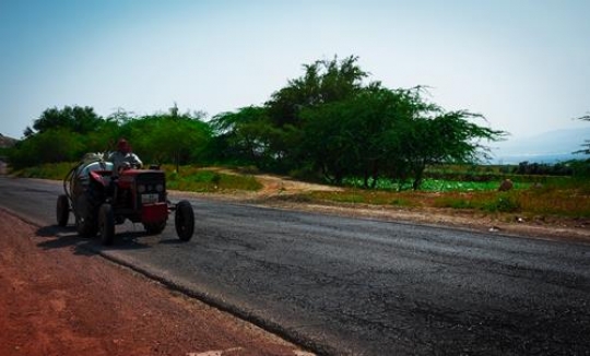 tractor on a road from amman to jordan valley