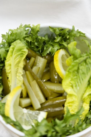pickles,lettuce and lemon in plate