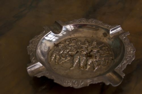 old tin ashtray
