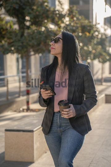 Professional Woman Enjoying Morning Coffee in Al Abdali Boulevard