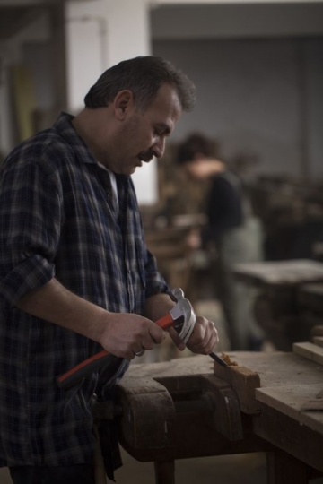 Man using hammer at the workshop 