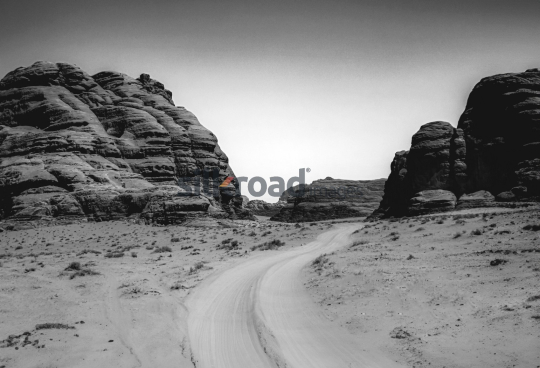 Winding Road Through Wadi Rum's Majestic Rocks
