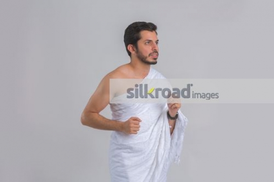 Middle Eastern man dressed in the traditional religious attire|