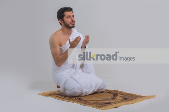 Arab man praying|